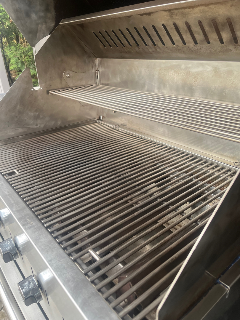 The same Crown Verity built-in grill after an Aspect deep clean, cooking grates and warming rack back to bare stainless steel